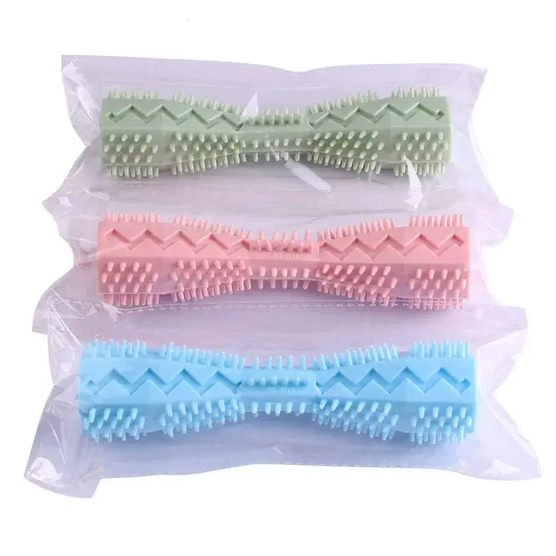 Colorful plastic hair rollers in green, pink, and blue stacked on top of each other.