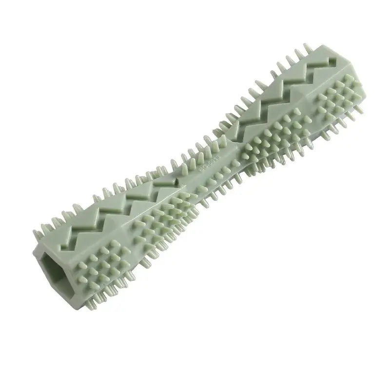 Pale green textured rubber chew toy with spiky protrusions and zigzag patterns.