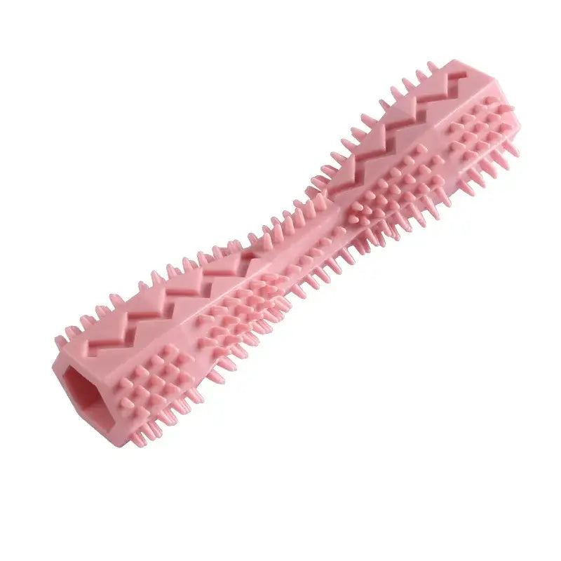 Pink rubber dog chew toy with textured spikes and ridges.