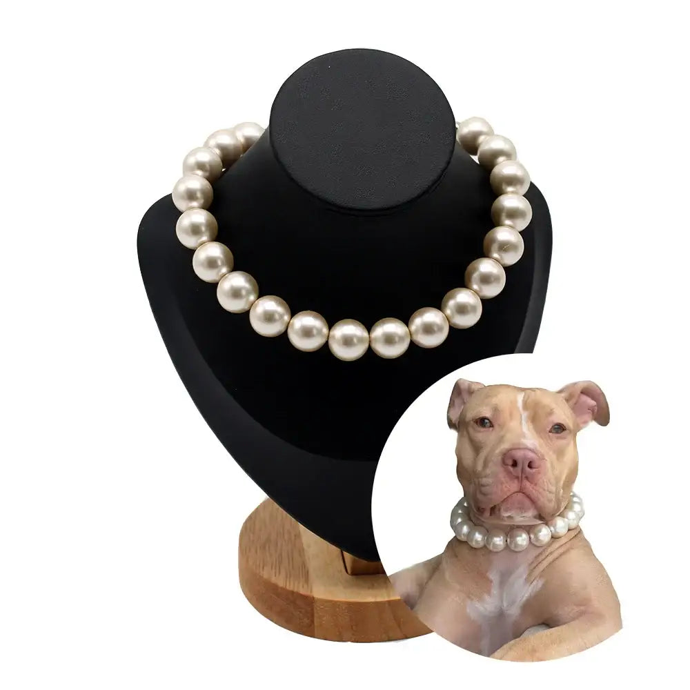 Pearl necklace displayed on a black bust form.