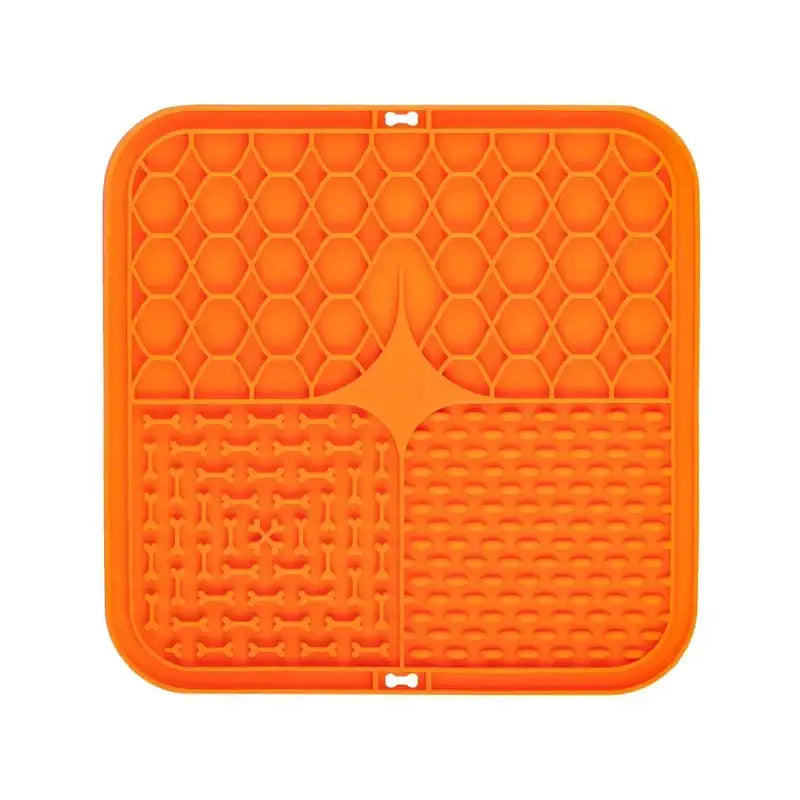 Bright orange square silicone mat with textured patterns.