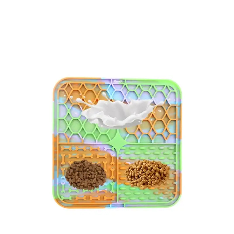 Compartmentalized plastic tray containing two types of dry pet food and a water bowl.