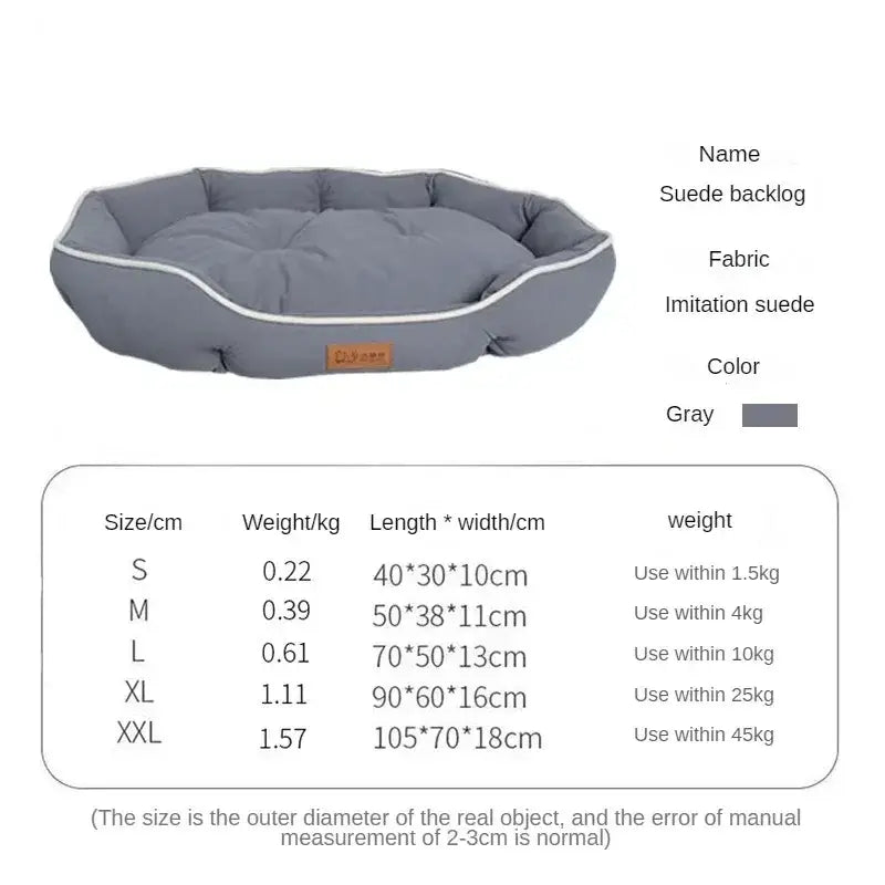 Gray oval-shaped pet bed with a plush cushioned interior and raised edges.