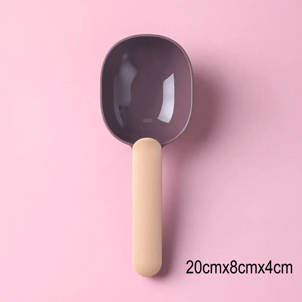 Purple plastic scoop with a light wooden handle.