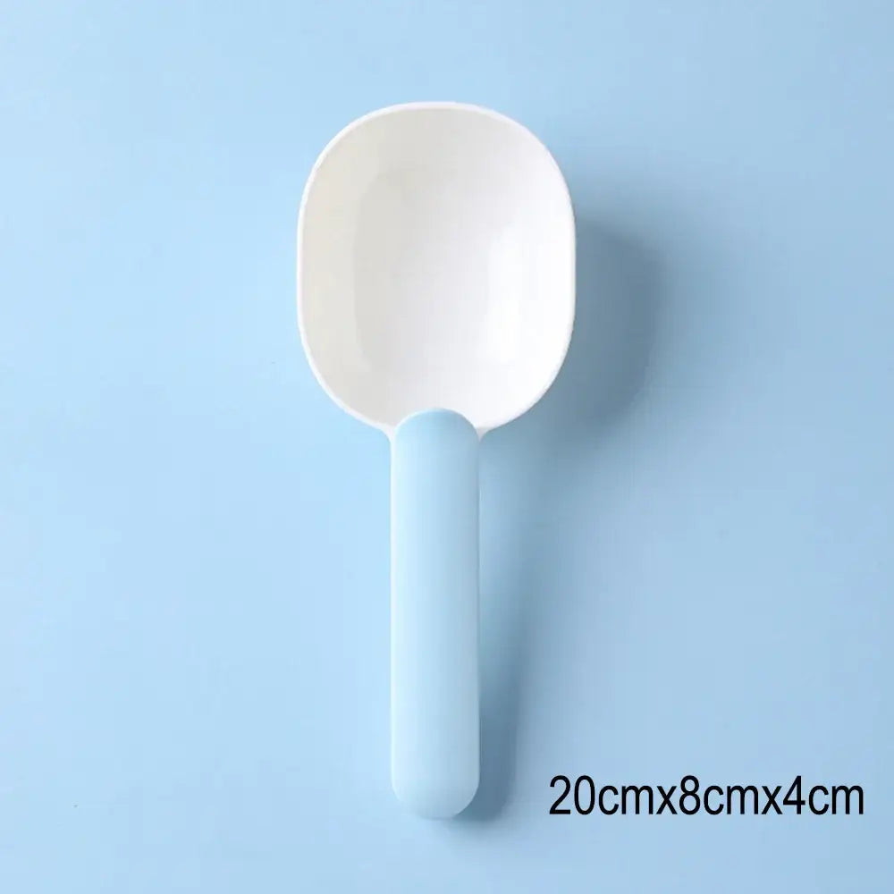 White plastic spoon or scoop with a light blue handle.