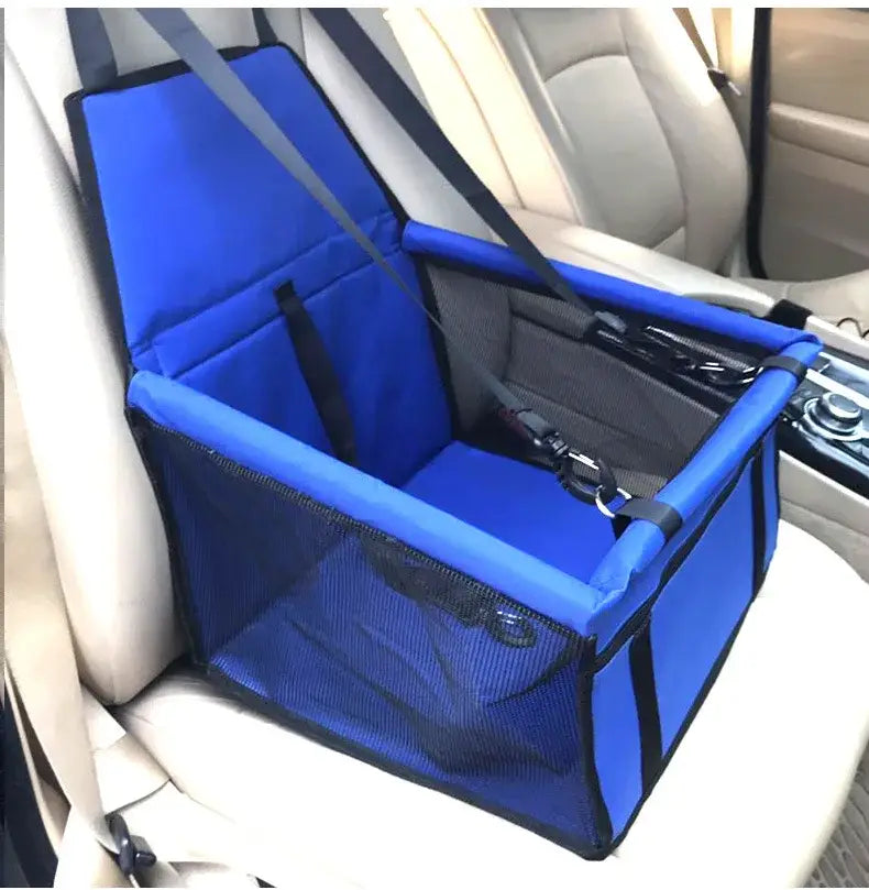 Blue pet carrier or car seat for small animals secured on a vehicle seat.