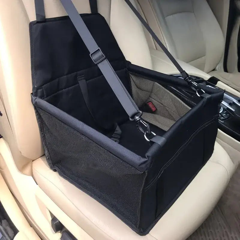 Pet car seat or carrier secured to a vehicle seat.