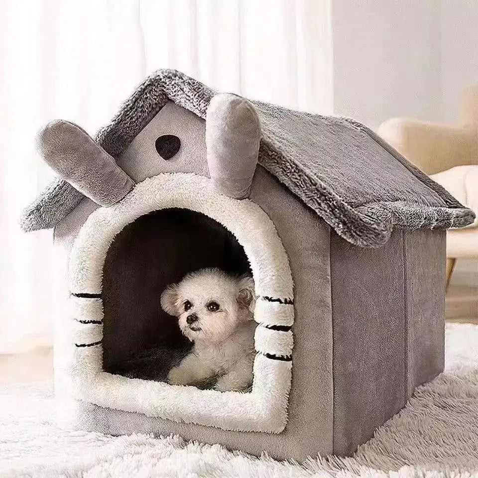 Plush dog house with bunny-ear design and a small white puppy peeking out from inside.