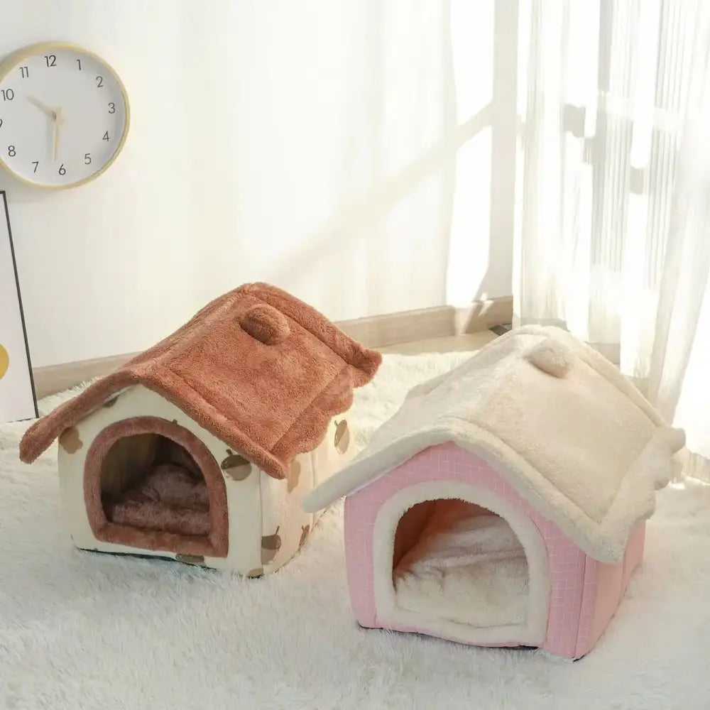 Two cozy pet houses shaped like miniature homes, one pink and one brown.