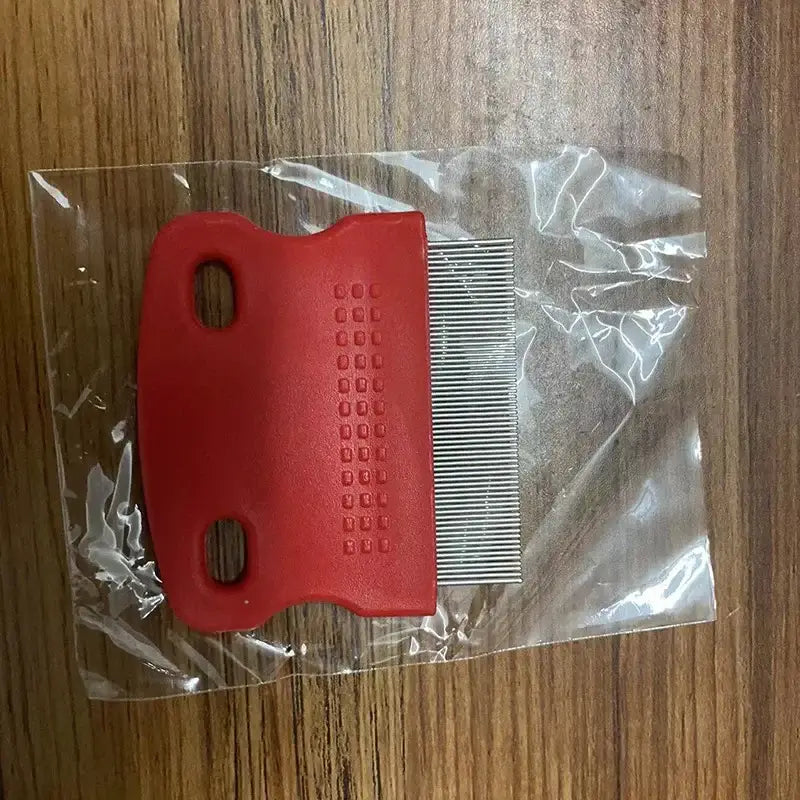 Red plastic lice comb with metal teeth in a clear plastic bag.