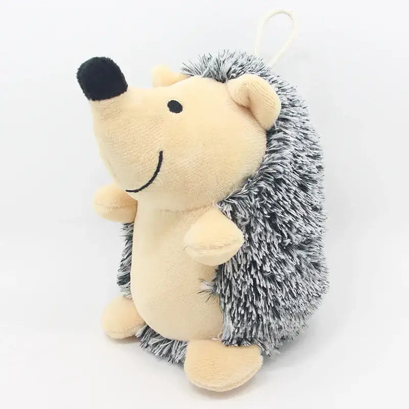 Plush toy hedgehog with a cream-colored body and gray spiky back.