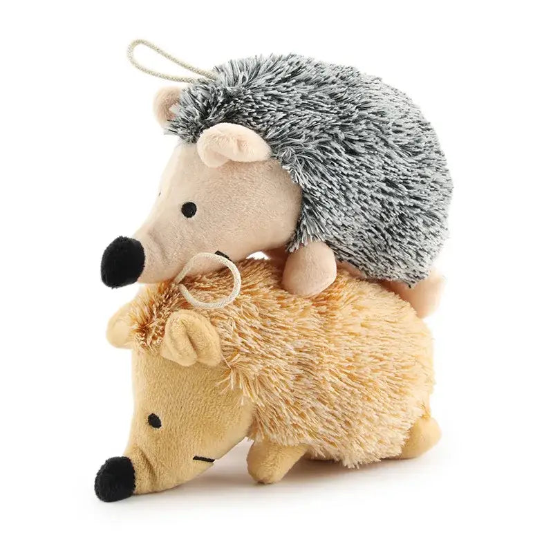 Two plush toy hedgehogs stacked on top of each other, one gray and one beige.