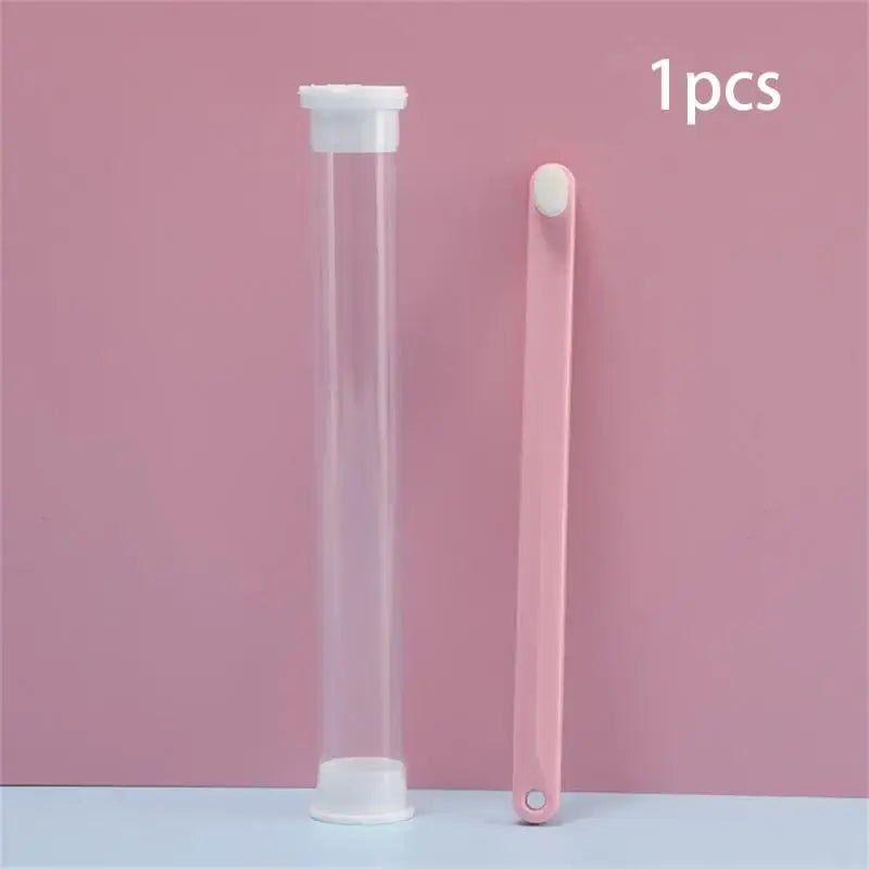 Clear plastic test tube with white caps on both ends.