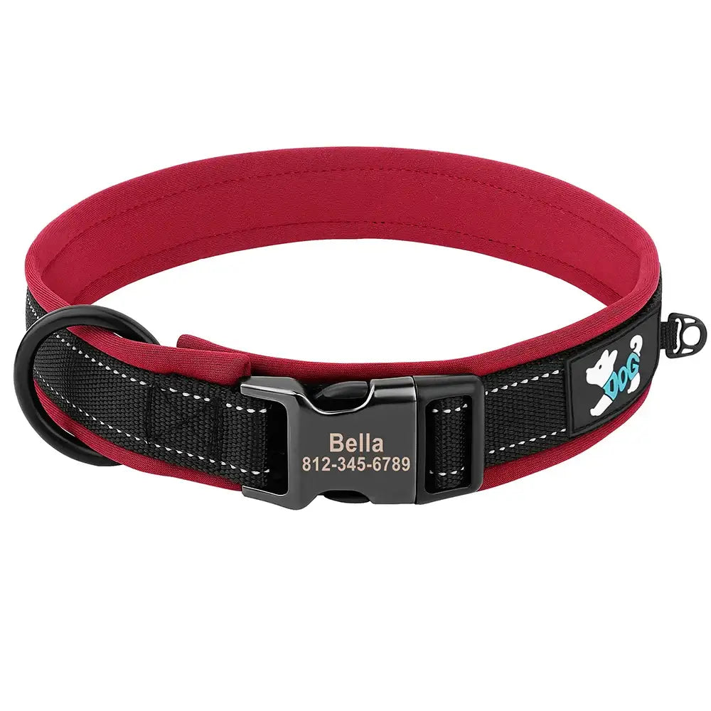 Dog collar with a red padded interior and black exterior featuring a personalized name tag.