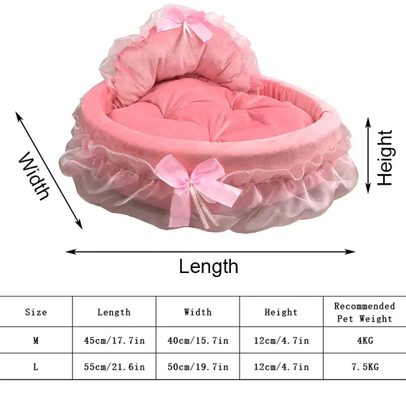 Pink, frilly, heart-shaped pet bed with bows.