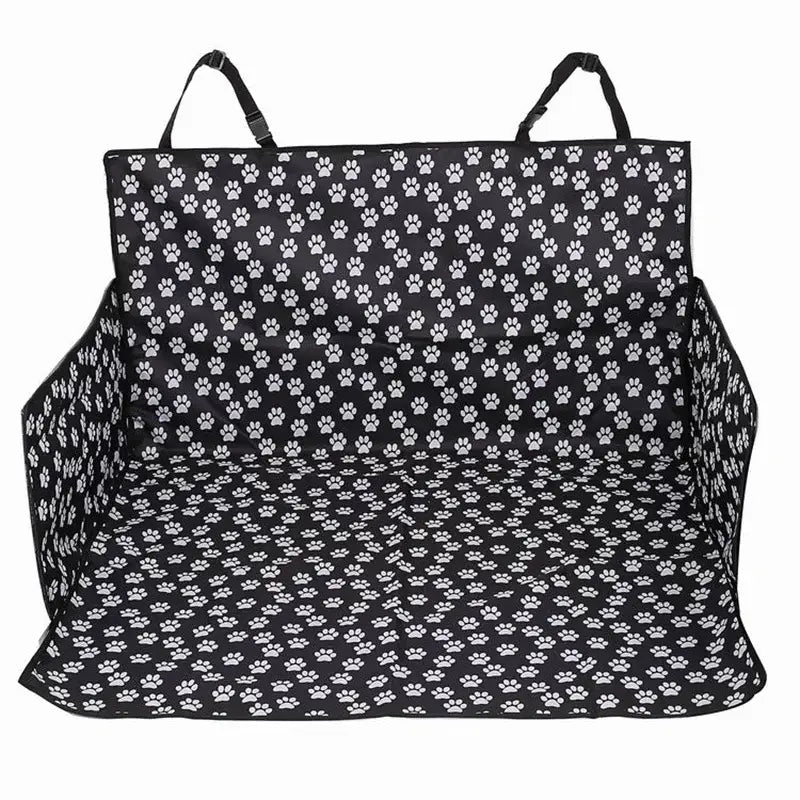 Pet car seat cover with a black and white paw print pattern.