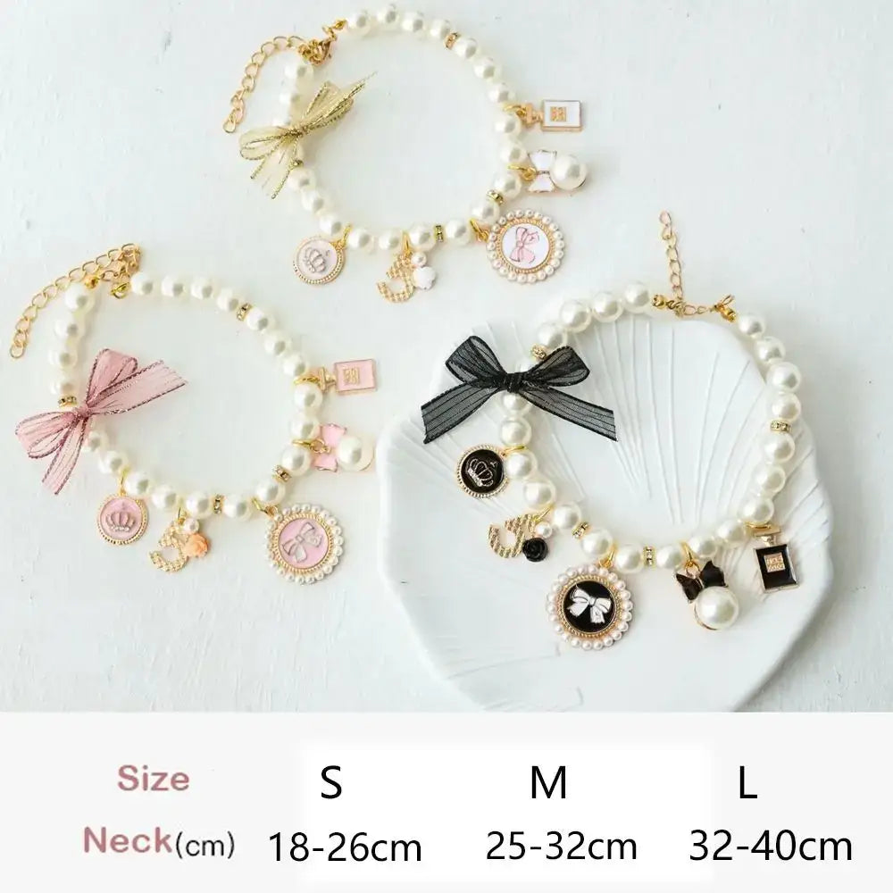 Pearl necklaces with various charms and decorative elements.