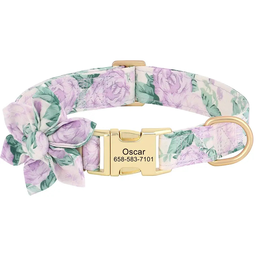 Floral-patterned dog collar with a gold buckle and engraved name tag.