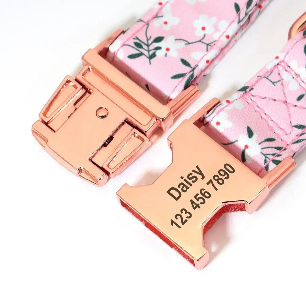 Floral patterned dog collar with rose gold hardware and personalized name tag.