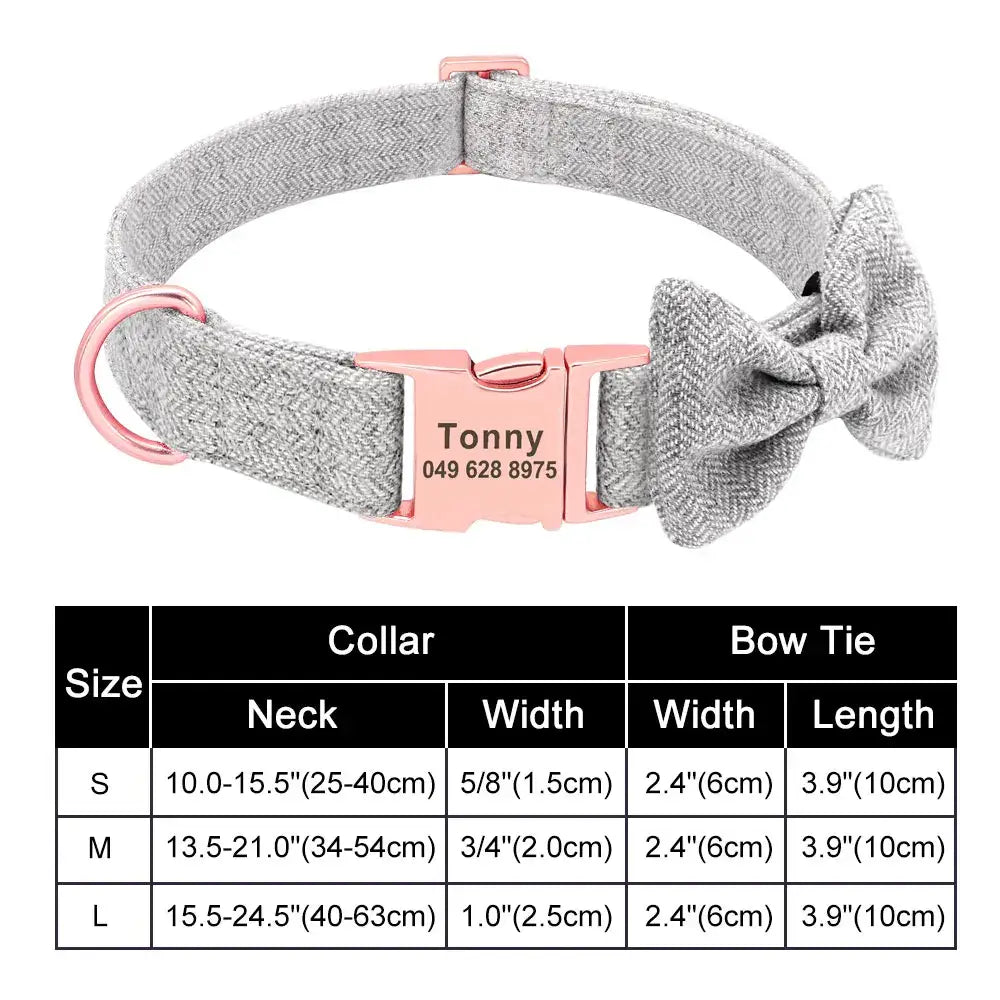 Gray fabric dog collar with a pink buckle, bow, and personalized name tag.