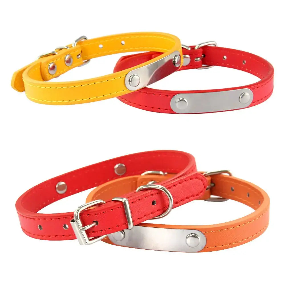 Colorful leather dog collars with metal name plates and buckles.