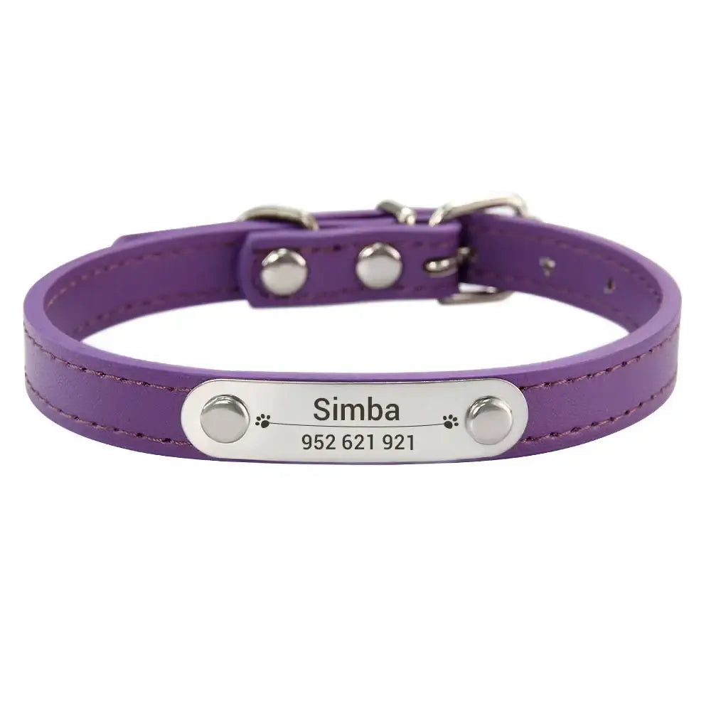 Purple leather dog collar with a personalized metal nameplate reading ’Simba’ and a phone number.