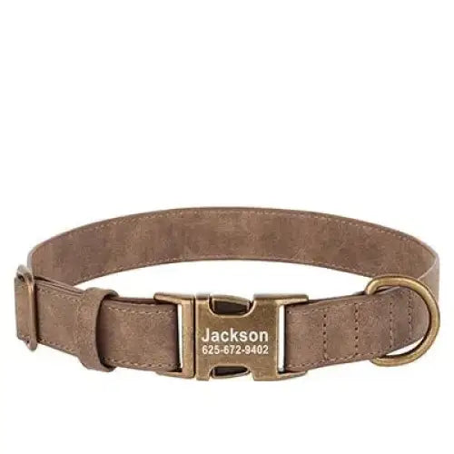 Brown leather dog collar with a personalized metal tag and buckle closure.