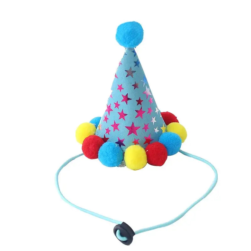 Colorful party hat with stars and pom-poms attached to an elastic strap.