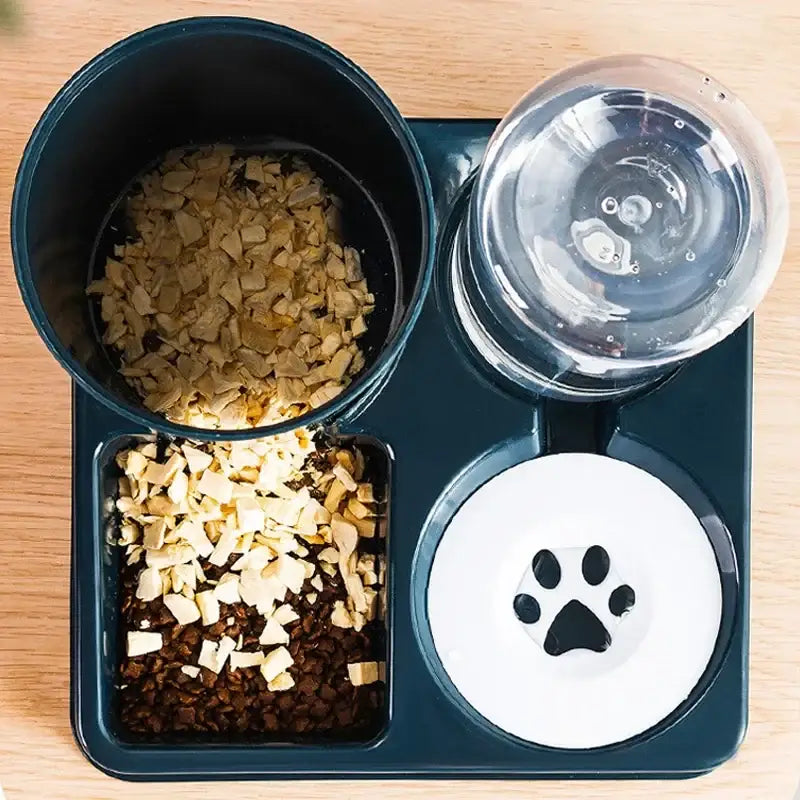 Pet food tray with compartments containing kibble, water, and treats.