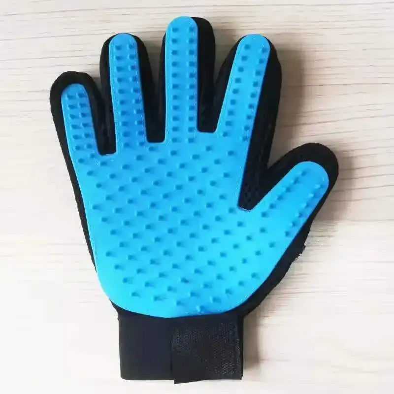 Blue and black pet grooming glove with raised silicone nubs.