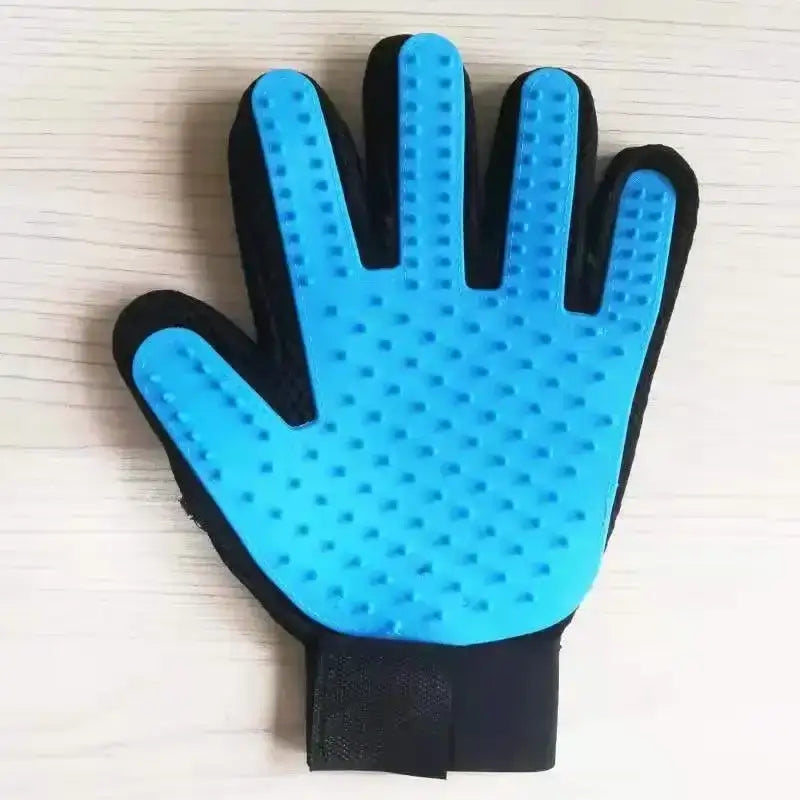 Blue and black pet grooming glove with textured palm surface.