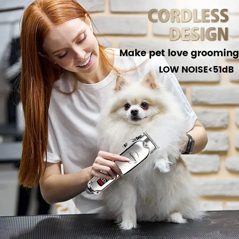 Cordless pet grooming clipper being used on a fluffy white Pomeranian dog.