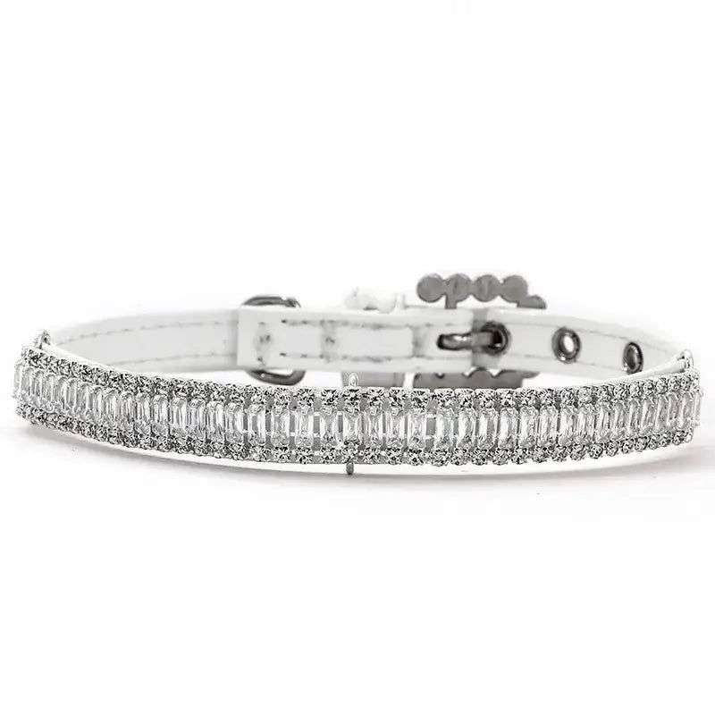 Sparkling diamond bracelet with baguette-cut stones set in a white metal band.