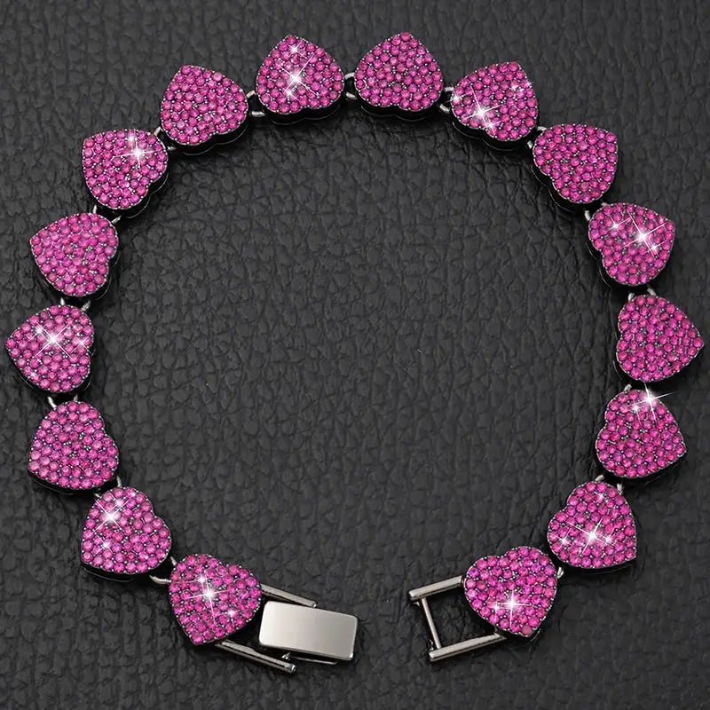 Bracelet made of heart-shaped pink gemstones or crystals with a silver clasp.