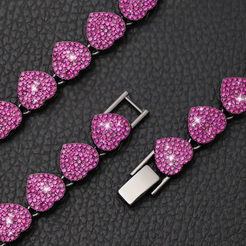 Sparkling pink gemstone necklace with heart-shaped links and a clasp.