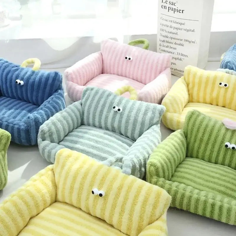 Colorful miniature plush sofas with cute cartoon eyes.