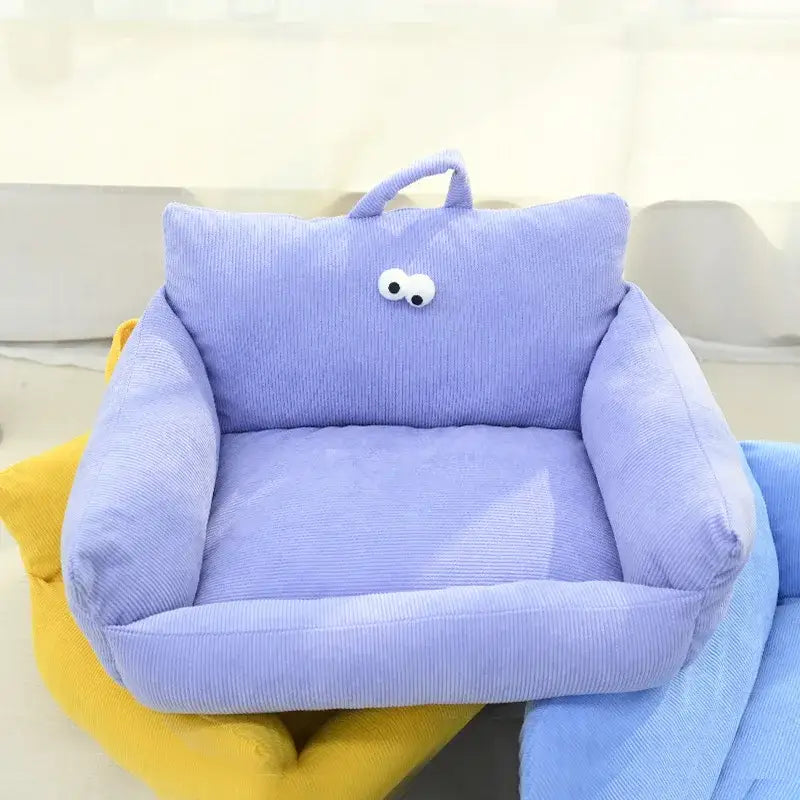 Cute purple plush armchair with googly eyes for children.