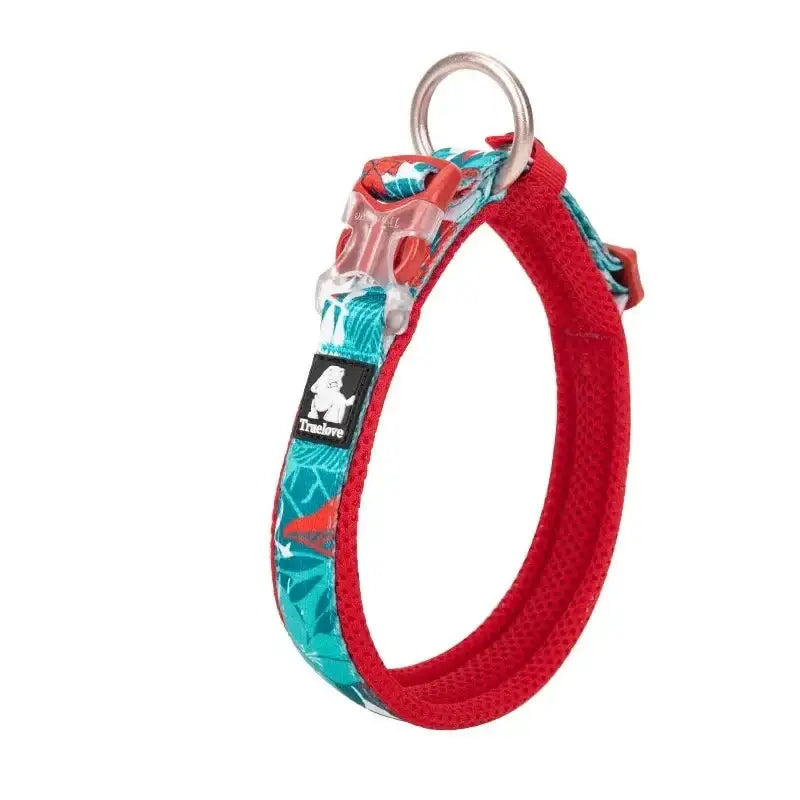 Dog collar with a red base and teal floral pattern.