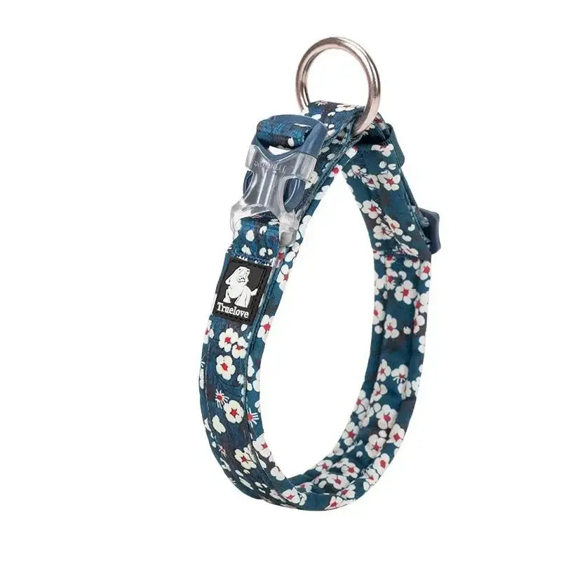 Floral patterned dog collar with a metal buckle and ring.