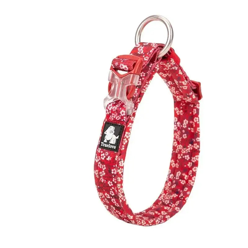 Red floral patterned dog collar with a metal ring attachment.