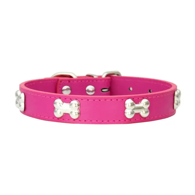 Bright pink leather dog collar adorned with silver bone-shaped studs.