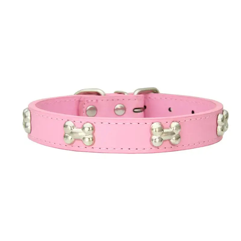 Pink leather dog collar adorned with silver bone-shaped studs.