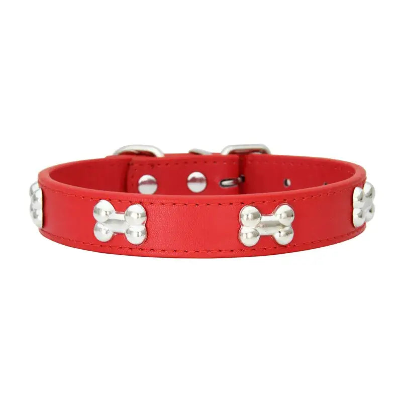 Red leather dog collar decorated with silver bone-shaped studs.