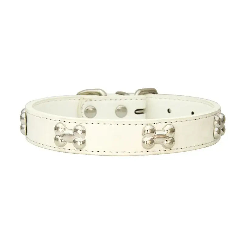 White leather dog collar with bone-shaped studs.