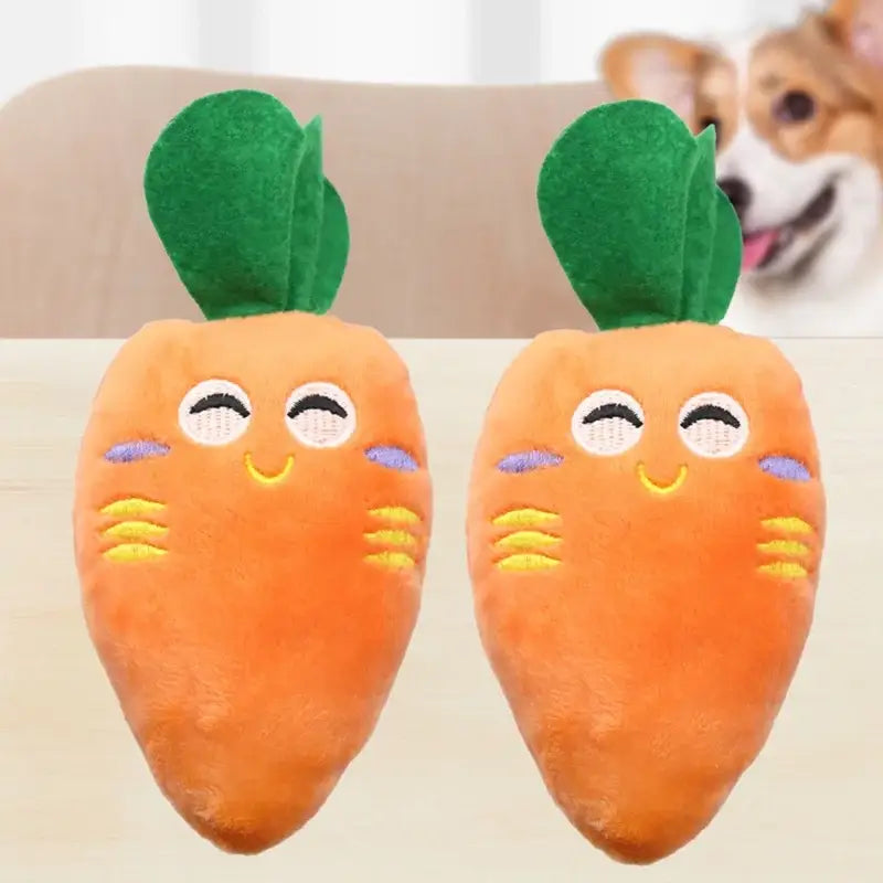 Two smiling plush carrot toys with green leaves on top.