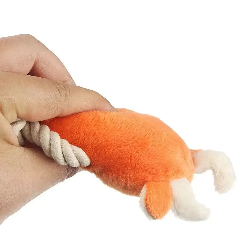 Orange plush toy shaped like a shrimp or prawn with a rope attachment.