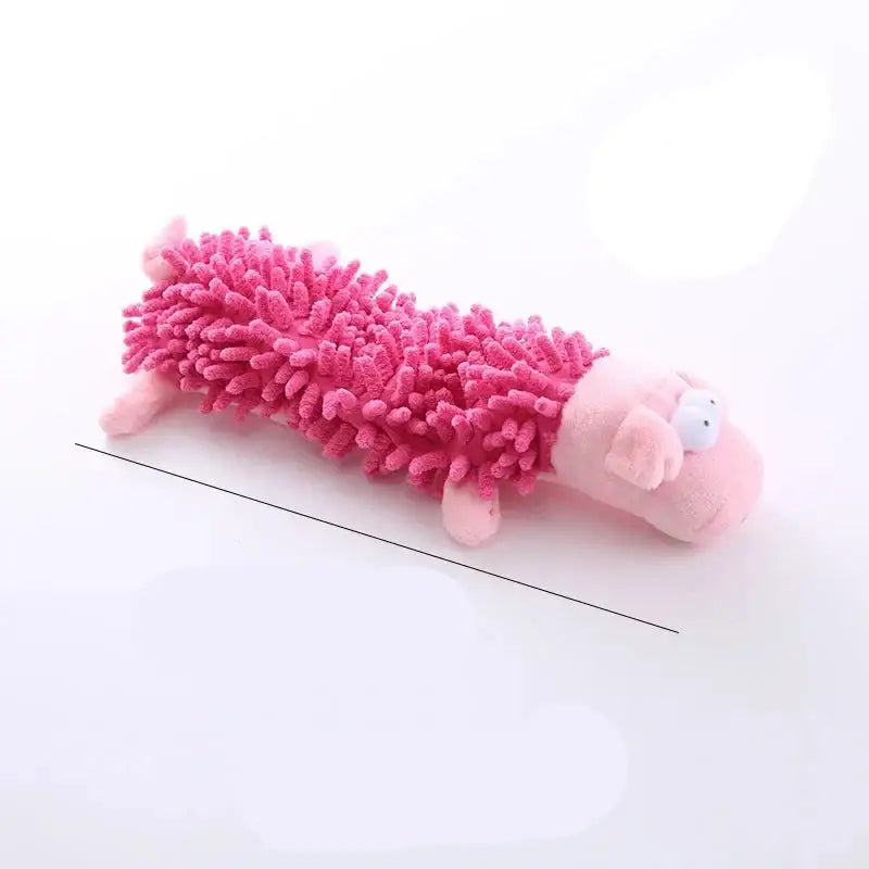 Pink plush toy pig with a fuzzy, mop-like body.