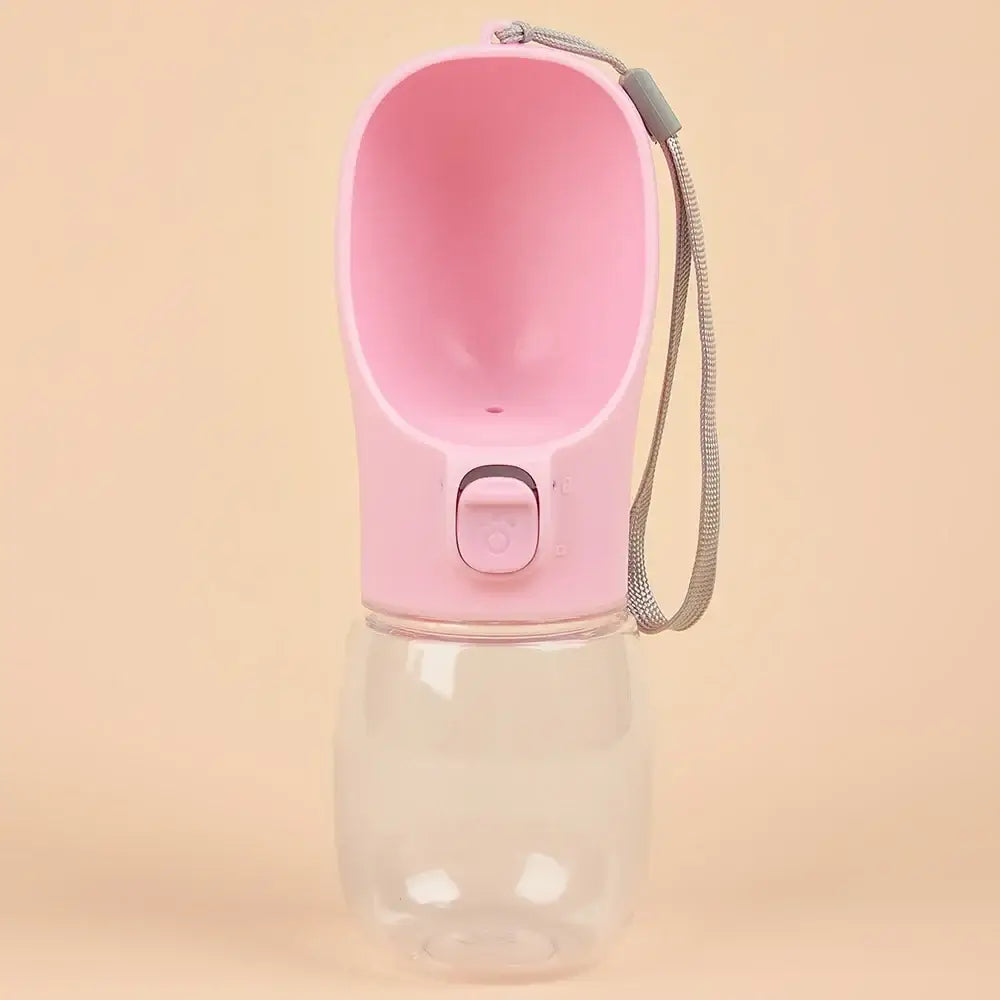 Pink-topped portable water bottle with a carrying strap.