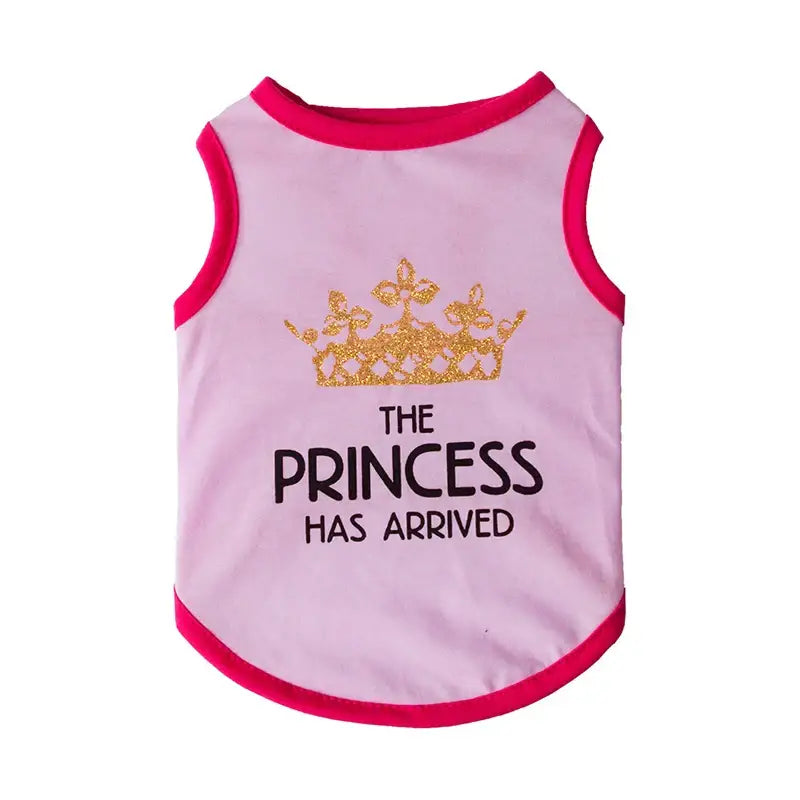 Pink dog shirt with ’The Princess Has Arrived’ text and a golden crown graphic.