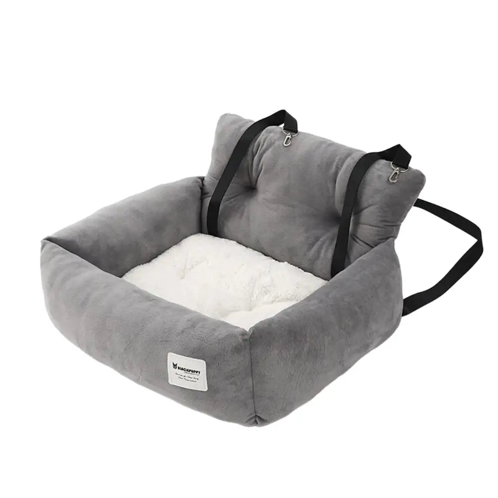 Gray pet car seat with white cushion and black straps.